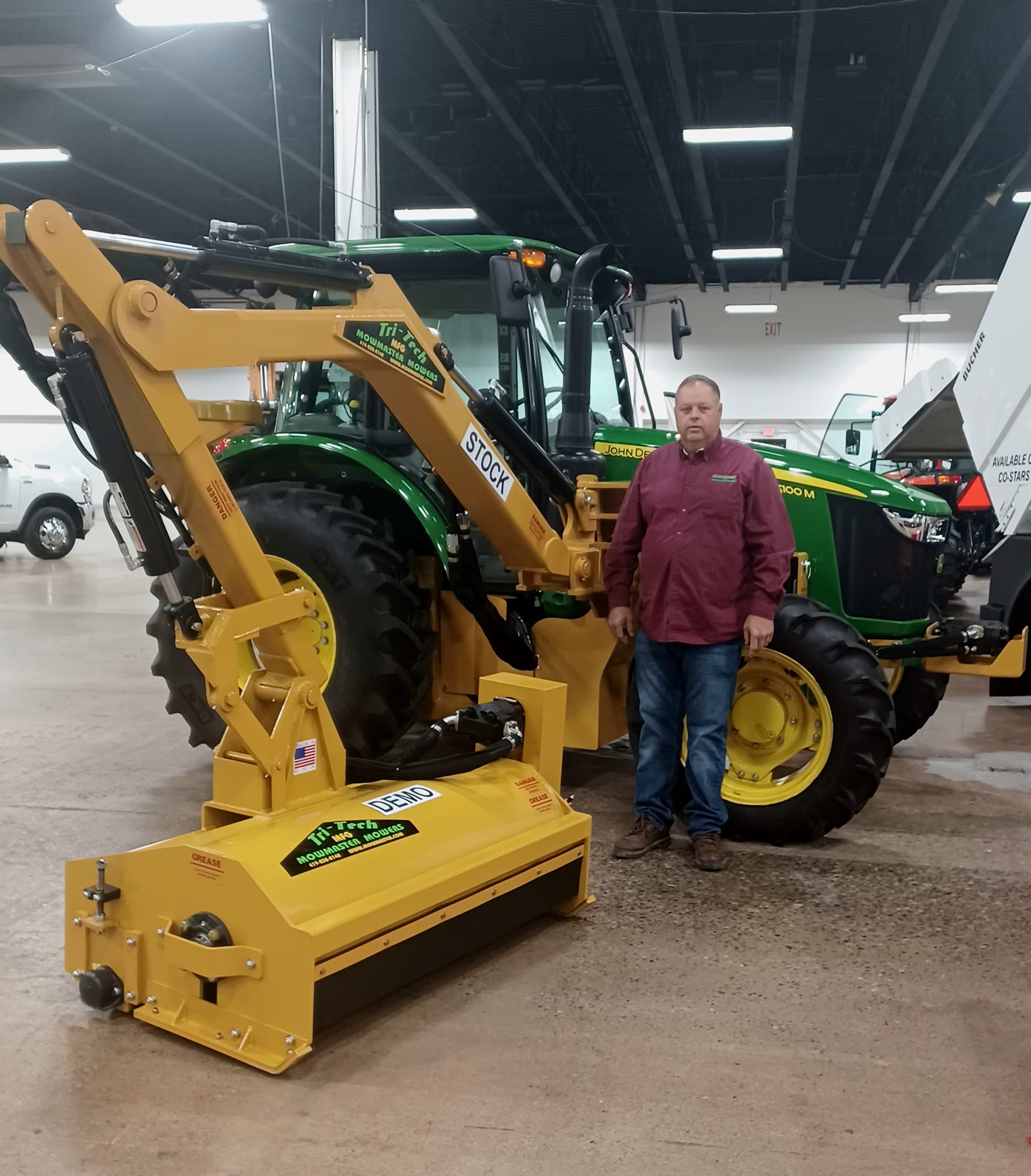 Dan Teman with MowMaster boom mower on John Deere tractor