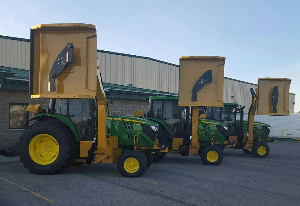 Three John Deere tractors with MowMaster side mount mowers